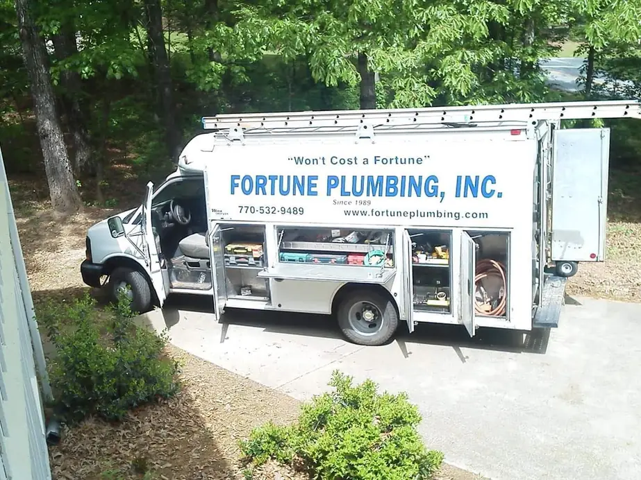 A Fortune Plumbing truck lettered with Won't Cost a Fortune, the company name and Since 1989